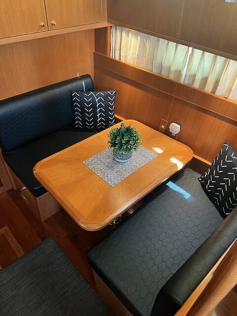 Boat dinette with newly upholstered black seating in southeastern Ohio
