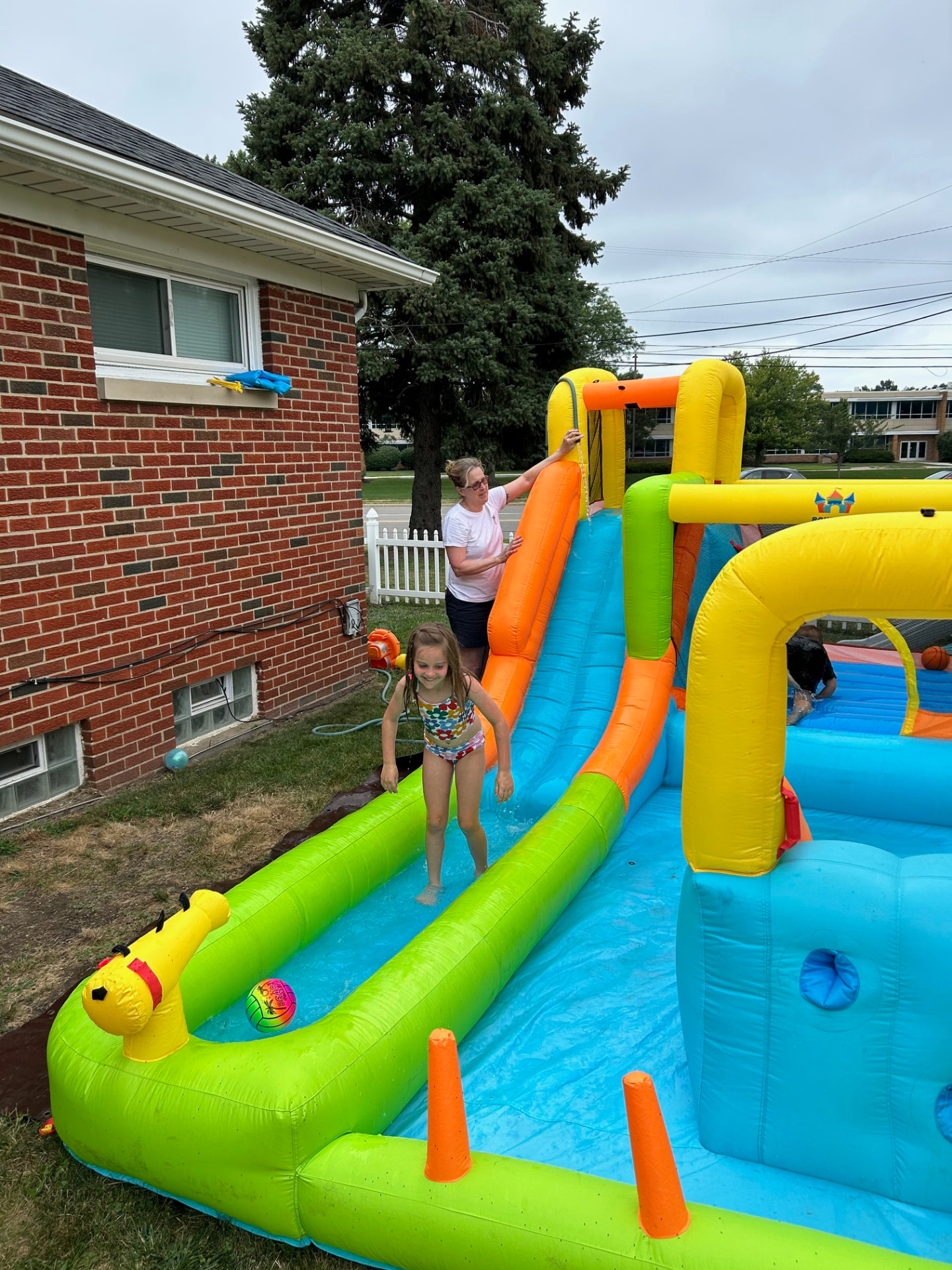 Bright inflatable water slide sewing project in southeastern Ohio