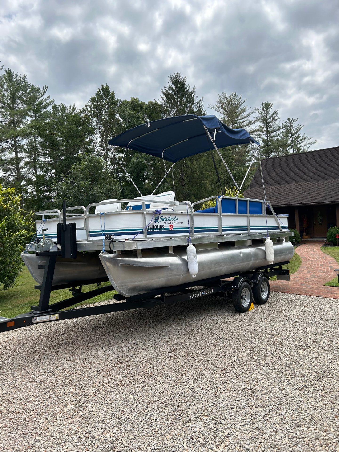 Finished pontoon with navy canopy outside a customer's home in southeastern Ohio