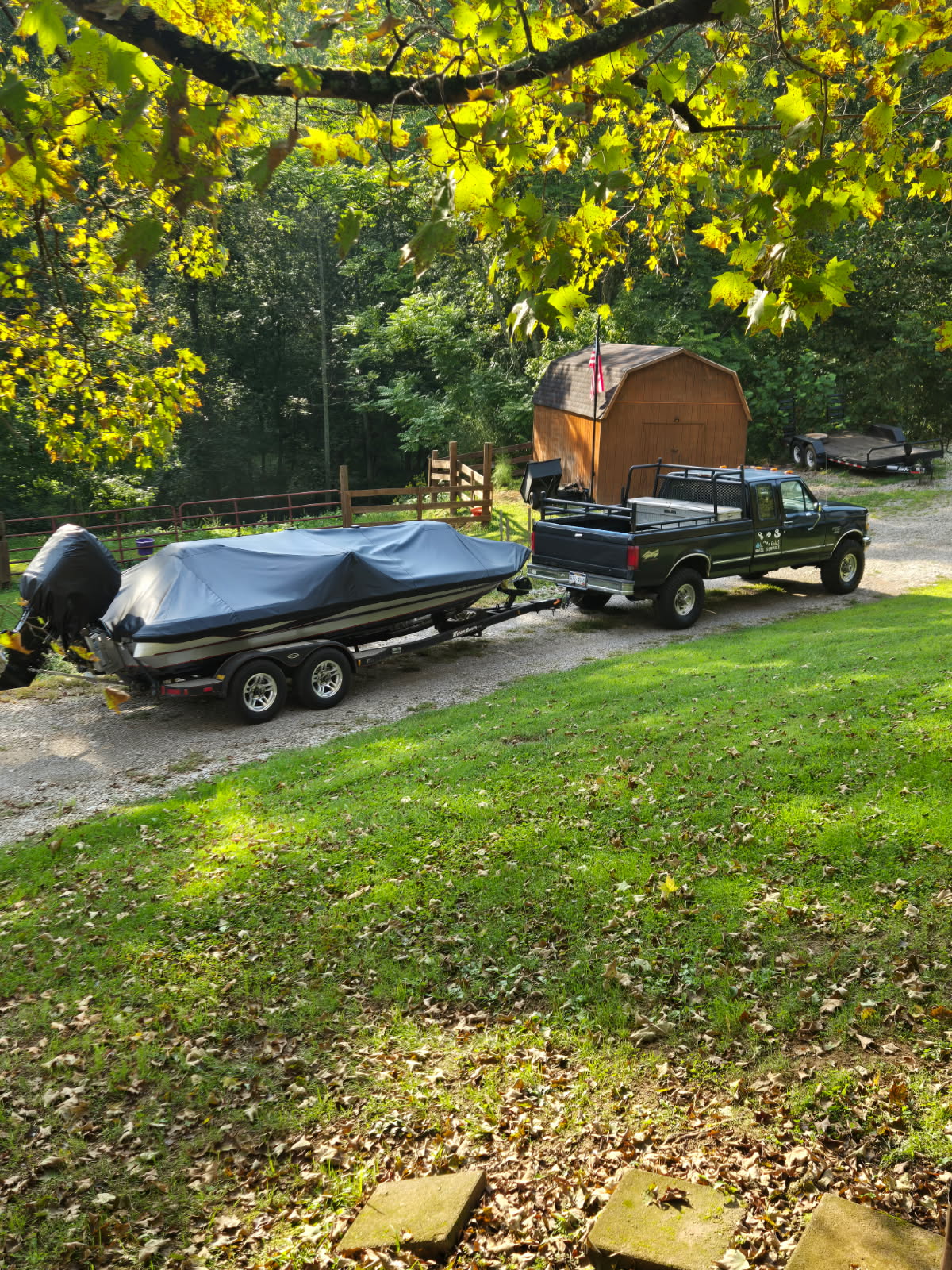 Boat under a custom storage cover in the trees in southeastern Ohio