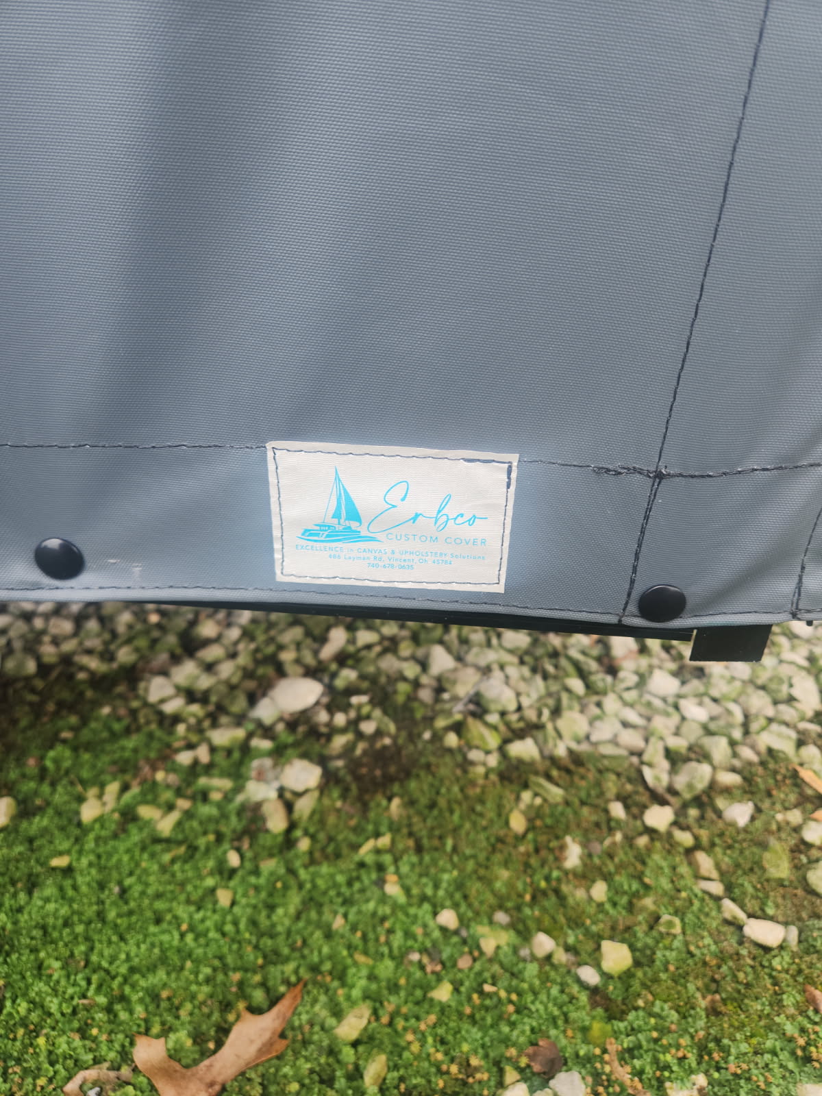 Gray custom boat cover with the Erbco label in southeastern Ohio
