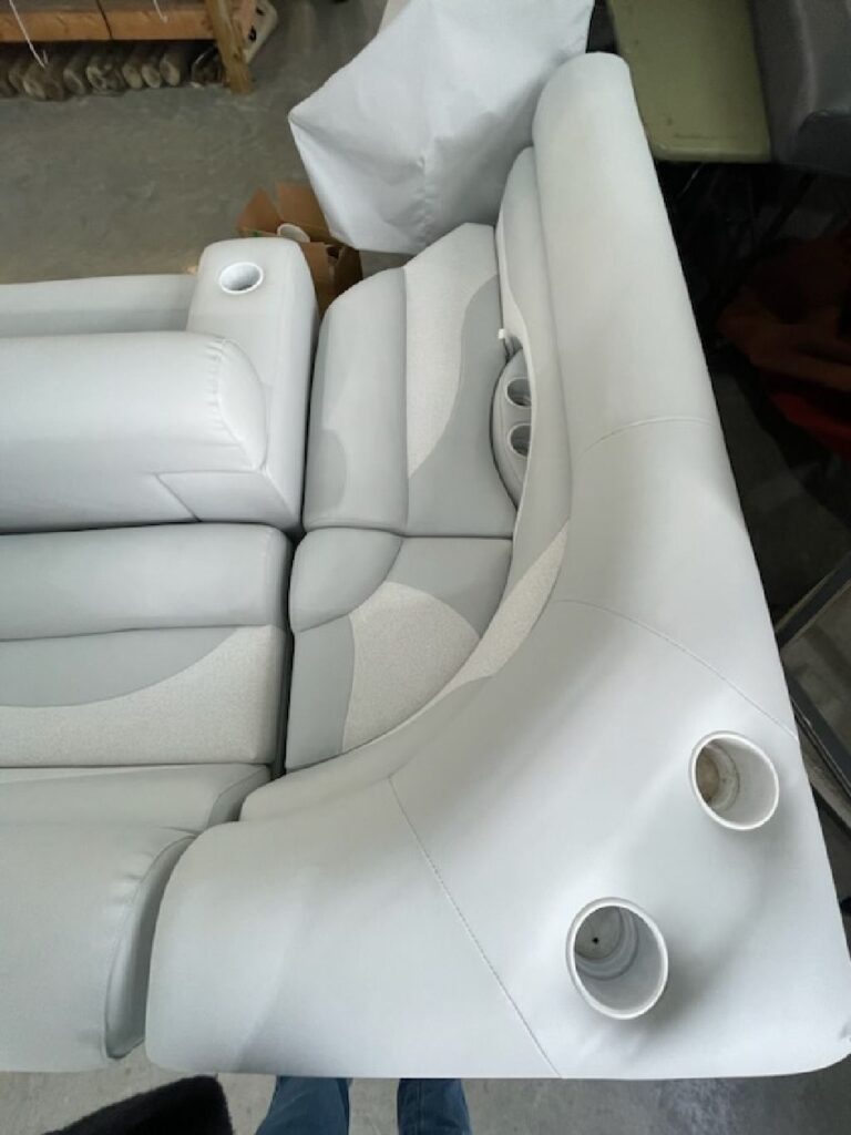 White and gray boat upholstery with integrated cupholders in southeastern Ohio