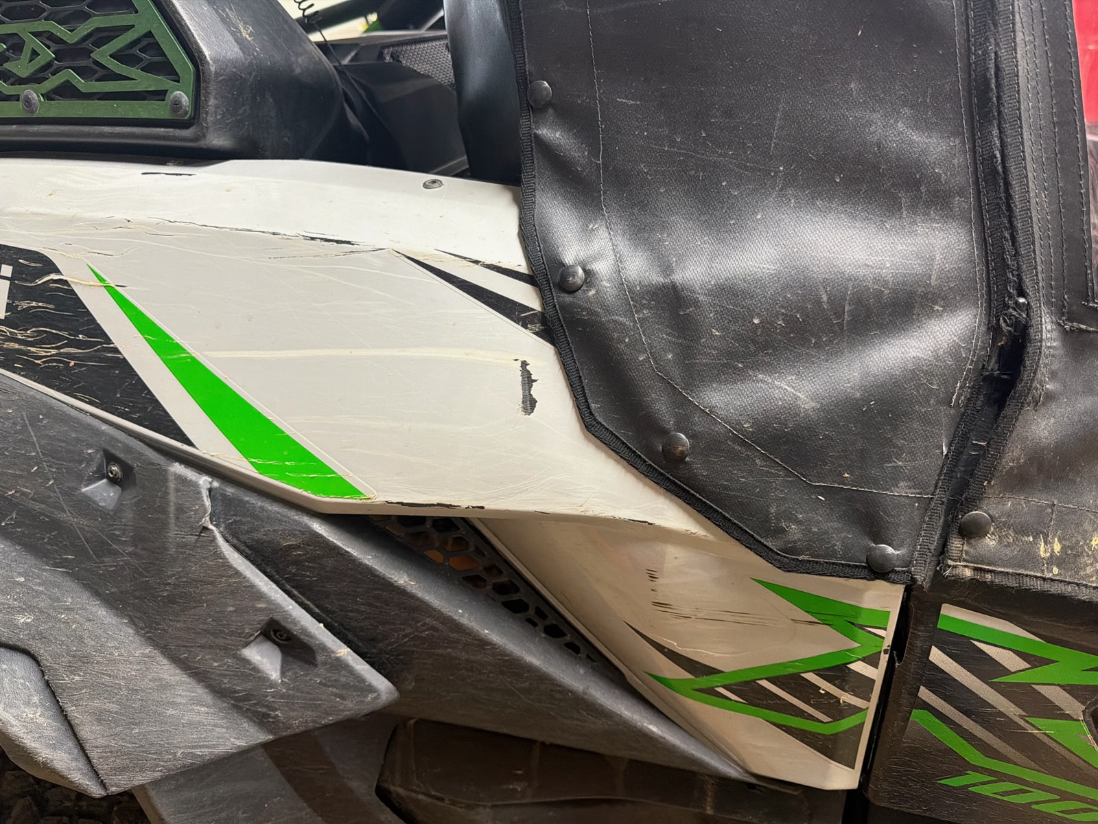 Snap-on cover fitted to a green boat in southeastern Ohio