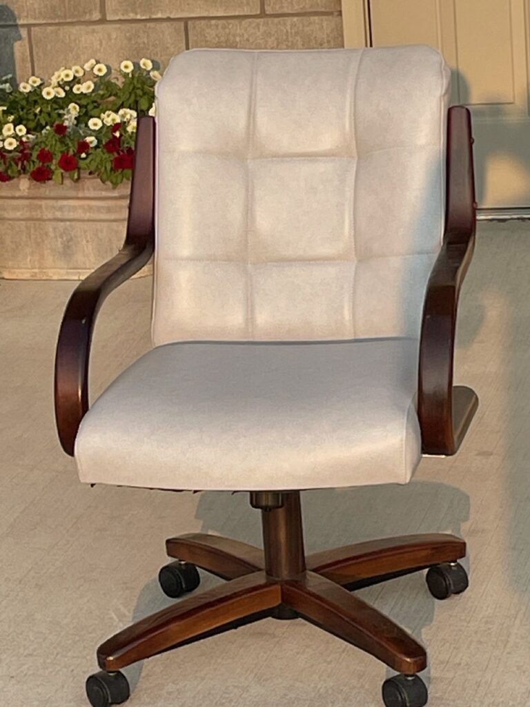 White upholstered chair with dark wood frame re-covered by Erbco