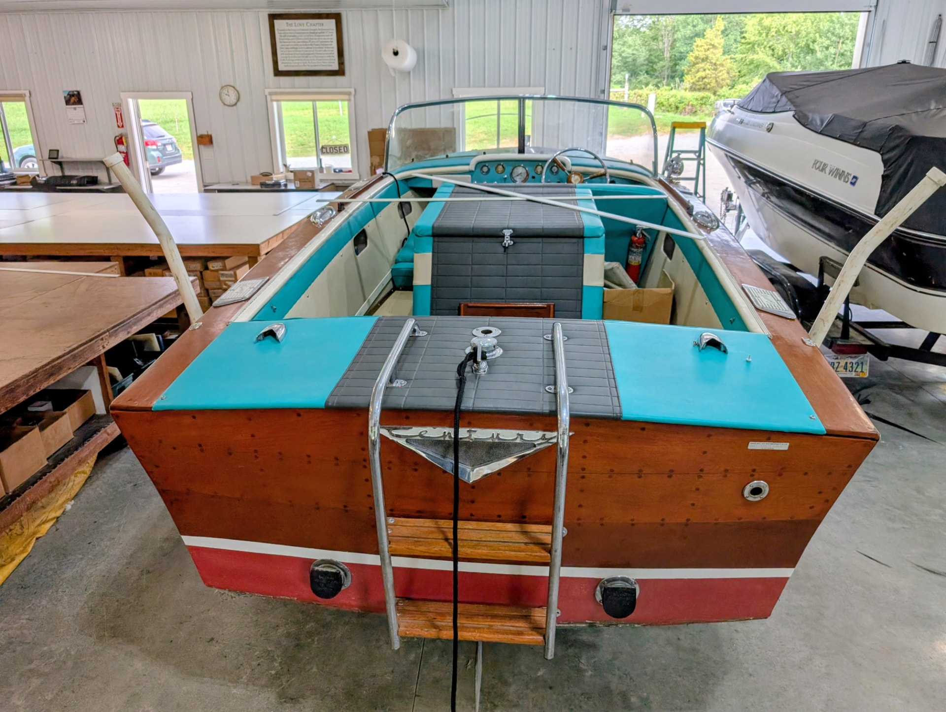 Turquoise and gray upholstery in a restored wooden boat in southeastern Ohio