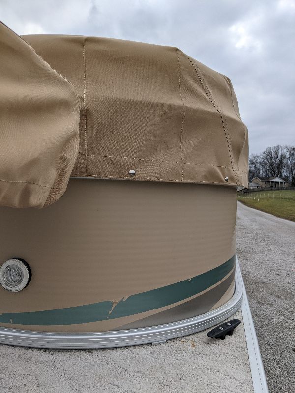 Fitted tan covers on pontoon stern seating in southeastern Ohio