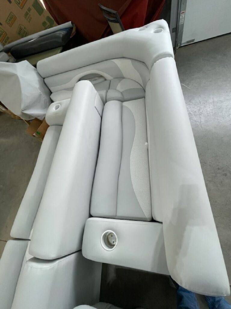 Newly upholstered white and gray boat seats in the workshop in southeastern Ohio