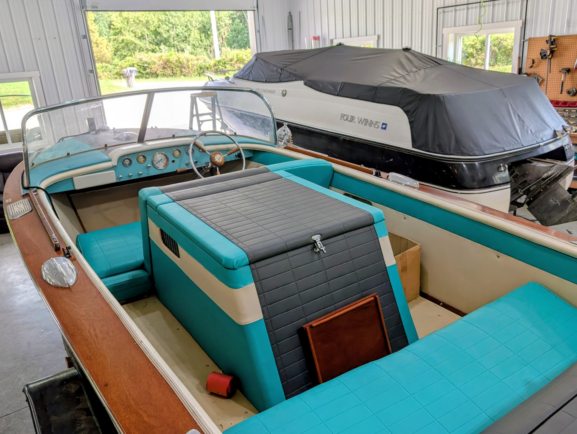 Restored turquoise and gray wooden boat interior in southeastern Ohio