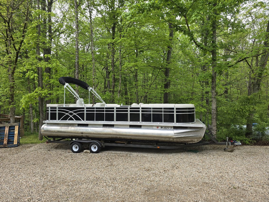Pontoon boat with a custom enclosure installed by Erbco in Vincent, Ohio