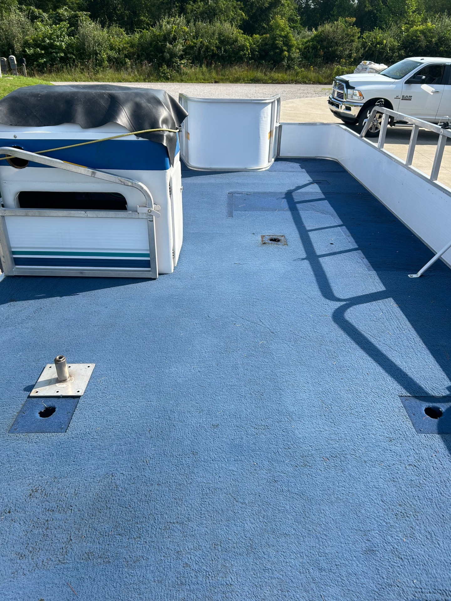 Blue marine flooring fitted to a pontoon deck in southeastern Ohio