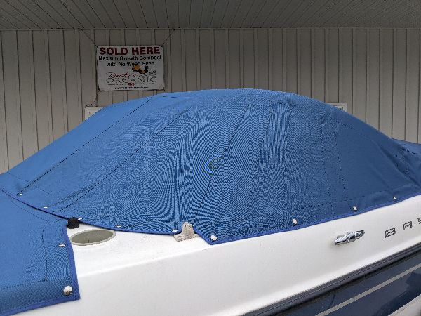 Side profile of a fitted blue boat cover in southeastern Ohio