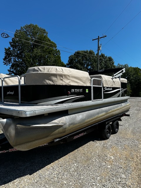 Pontoon boat with custom canvas cover in southeastern Ohio