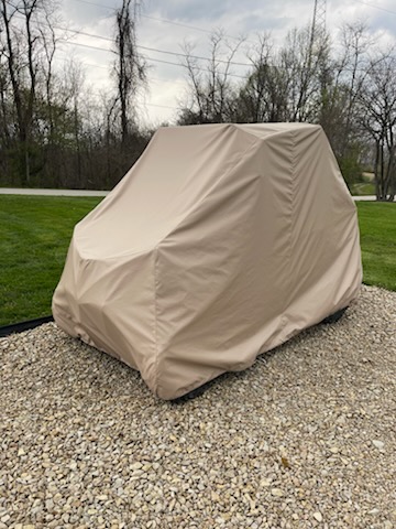 Tan custom cover on a UTV in southeastern Ohio